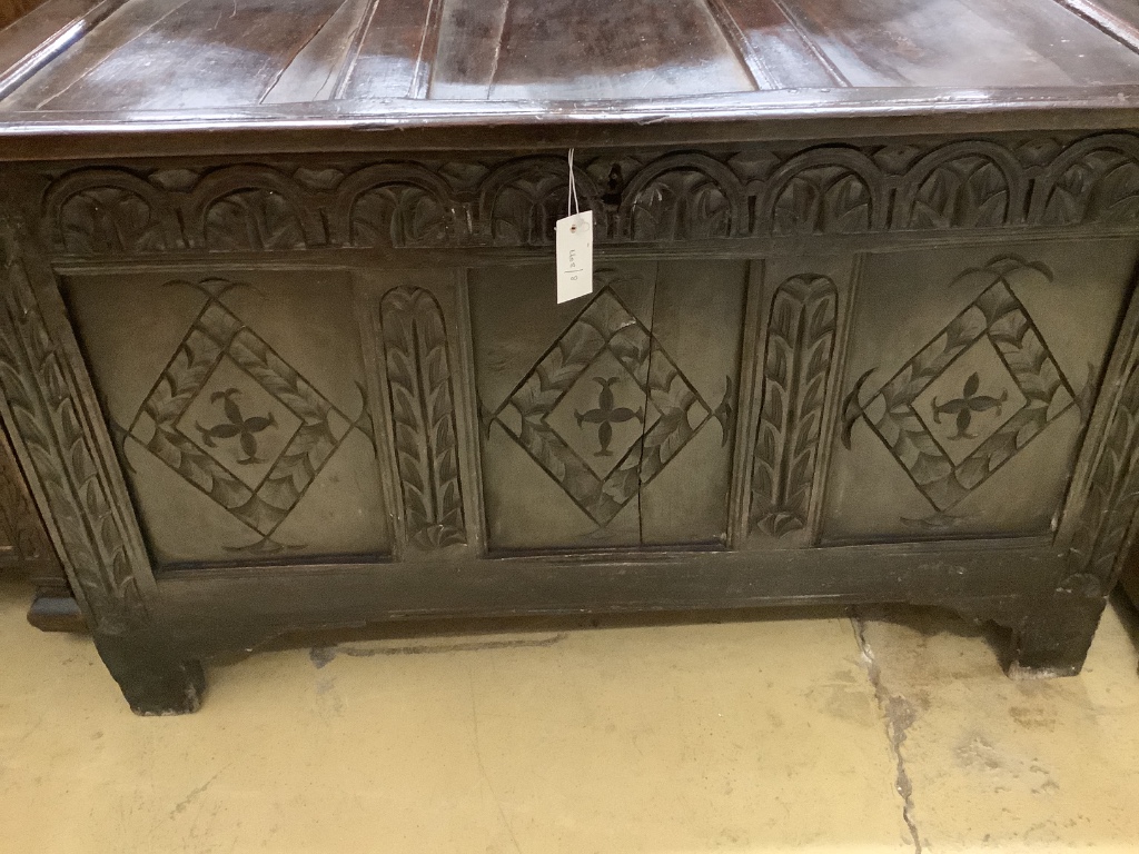 A late 17th / early 18th century carved panelled oak coffer, width 110cm depth 55cm height 65cm